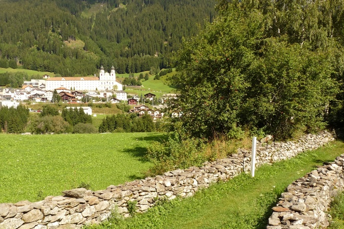 Dry stone wall with monastery