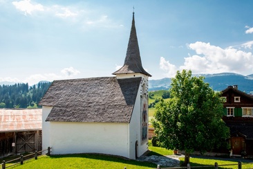 The photo shows the St. Martin chapel looking towards the village center