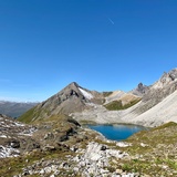 Stage 10: Ascent to Fuorcla da Tschitta. View back to Pizza Grossa, Cotschen, and Tinzenhorn